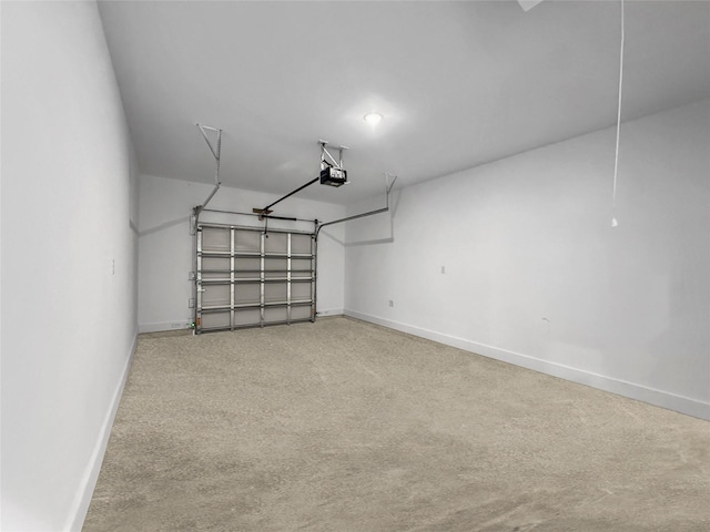 garage with a garage door opener and baseboards