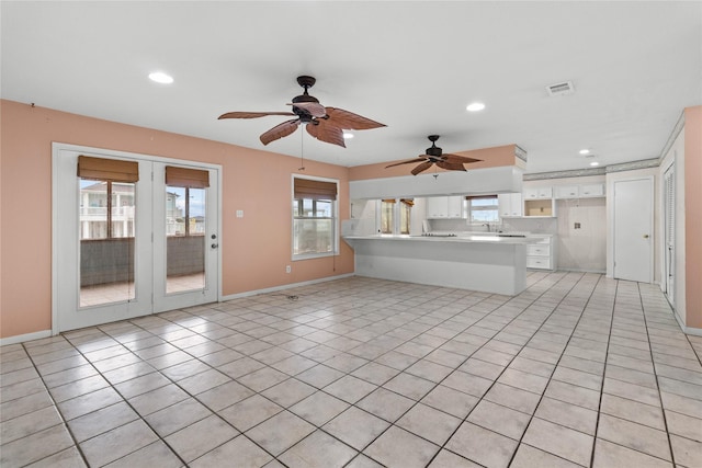 1114 Helen Dowdy Prt, Bolivar, TX 77650 - unfurnished living room featuring recessed lighting, light tile patterned floors, baseboards, ceiling fan, and a sink