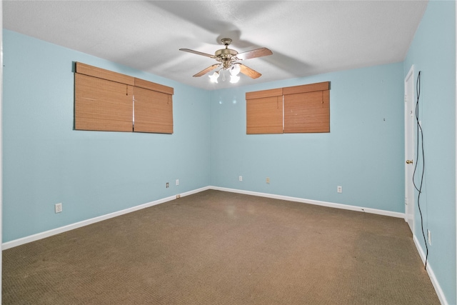 1114 Helen Dowdy Prt, Bolivar, TX 77650 - unfurnished room featuring dark carpet, ceiling fan, and baseboards