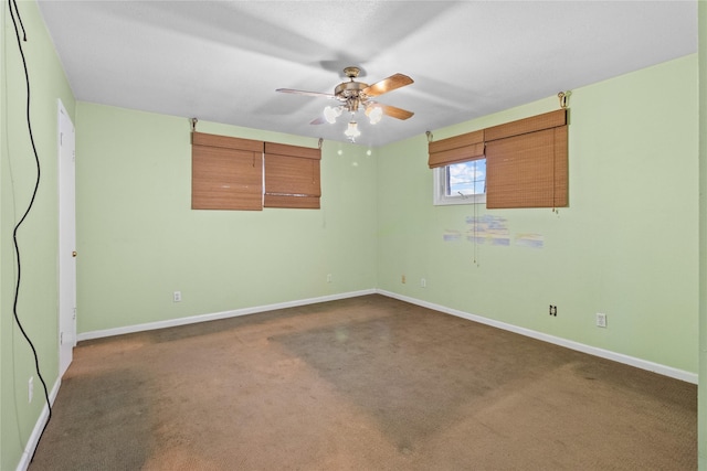 1114 Helen Dowdy Prt, Bolivar, TX 77650 - empty room with dark carpet, a ceiling fan, and baseboards