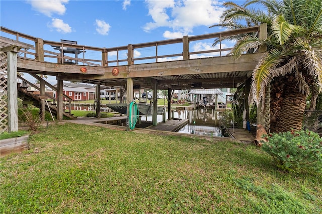 1114 Helen Dowdy Prt, Bolivar, TX 77650 - dock with boat lift, a yard, and a water view