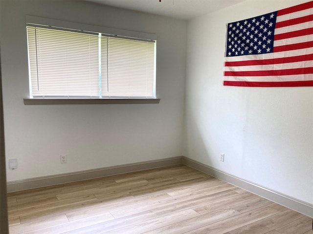 1402 Firwood Cir, Pasadena, TX 77502 - unfurnished room with wood finished floors and baseboards