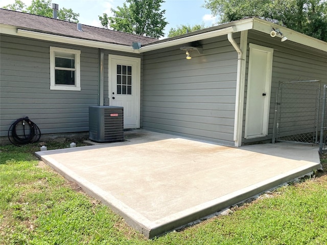 1402 Firwood Cir, Pasadena, TX 77502 - rear view of property with central AC unit and a patio area