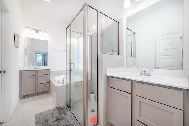 10554 Cecilia Star Ln, Richmond, TX 77406 - full bath featuring a stall shower, a garden tub, and two vanities