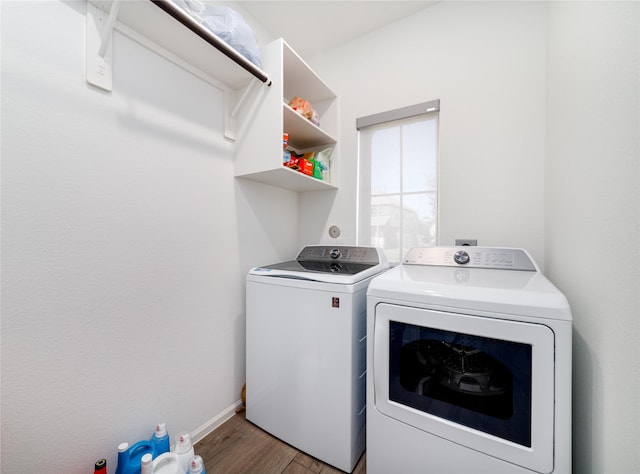 10554 Cecilia Star Ln, Richmond, TX 77406 - washroom featuring separate washer and dryer, wood finished floors, and baseboards