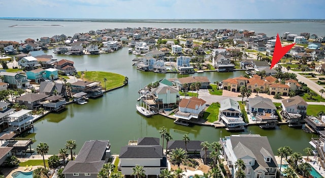 bird's eye view featuring a water view and a residential view