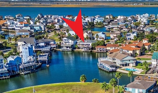 bird's eye view with a water view and a residential view