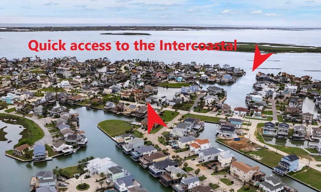 bird's eye view featuring a water view and a residential view
