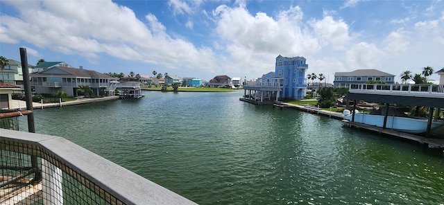 1435 Tiki Dr, Tiki Island, TX 77554 - water view featuring nearby suburban area and a boat dock