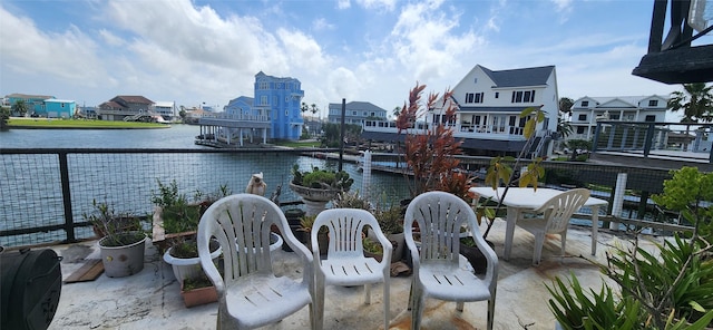 1435 Tiki Dr, Tiki Island, TX 77554 - view of patio with a water view
