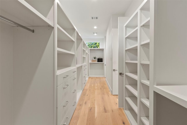 walk in closet with visible vents and light wood finished floors