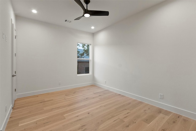 unfurnished room with light wood finished floors, ceiling fan, recessed lighting, and visible vents