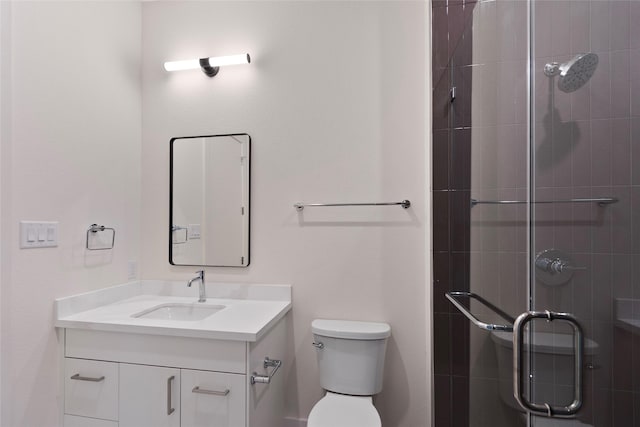full bath featuring a shower stall, toilet, and vanity