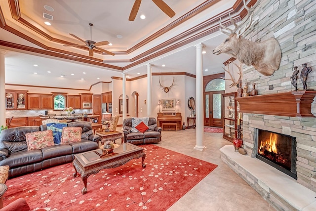 living area with crown molding, recessed lighting, ceiling fan, and decorative columns