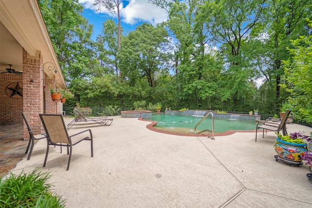 view of pool with a patio, ceiling fan, and a pool with connected hot tub