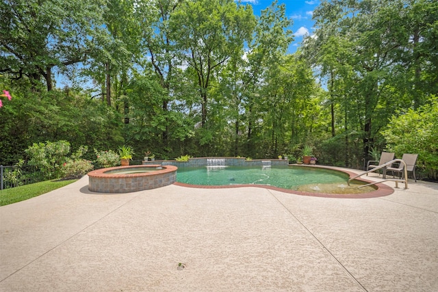 view of pool featuring a pool with connected hot tub and a patio area