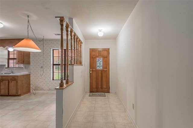350 Shoreline Dr, Huntsville, TX 77320 - hallway featuring visible vents, wallpapered walls, and baseboards