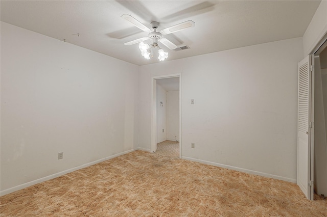 350 Shoreline Dr, Huntsville, TX 77320 - unfurnished bedroom with a closet, ceiling fan, visible vents, baseboards, and light colored carpet