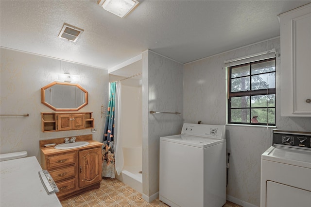 350 Shoreline Dr, Huntsville, TX 77320 - clothes washing area with a sink, separate washer and dryer, laundry area, visible vents, and a textured ceiling