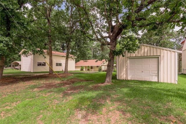 350 Shoreline Dr, Huntsville, TX 77320 - view of yard with a detached garage and an outbuilding