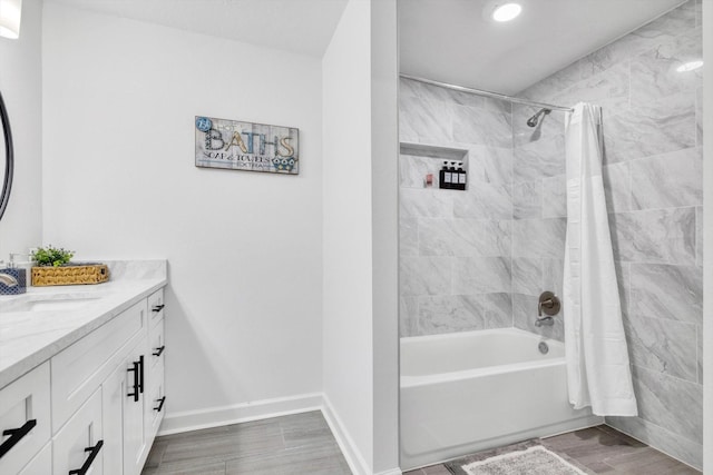 561 Brandon Rd, Conroe, TX 77302 - full bath with shower / bath combination with curtain, wood finished floors, vanity, and baseboards