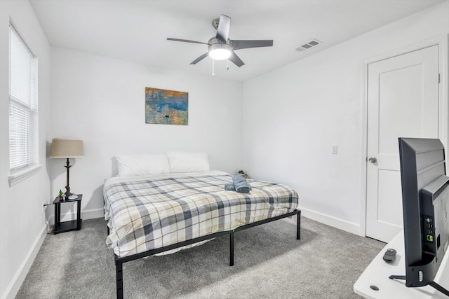561 Brandon Rd, Conroe, TX 77302 - carpeted bedroom featuring a ceiling fan, visible vents, and baseboards
