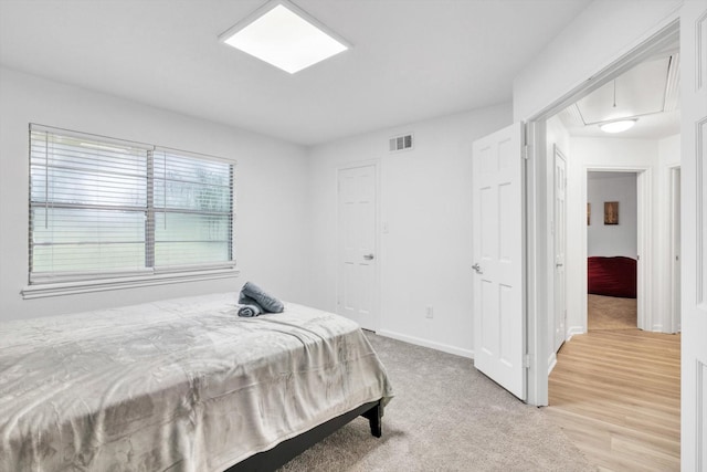 561 Brandon Rd, Conroe, TX 77302 - bedroom featuring attic access, visible vents, and baseboards