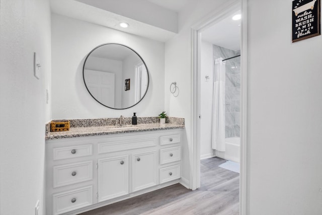 561 Brandon Rd, Conroe, TX 77302 - bathroom featuring vanity, shower / tub combo with curtain, recessed lighting, and wood finished floors