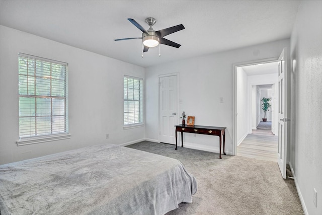 561 Brandon Rd, Conroe, TX 77302 - carpeted bedroom with a ceiling fan, baseboards, and multiple windows
