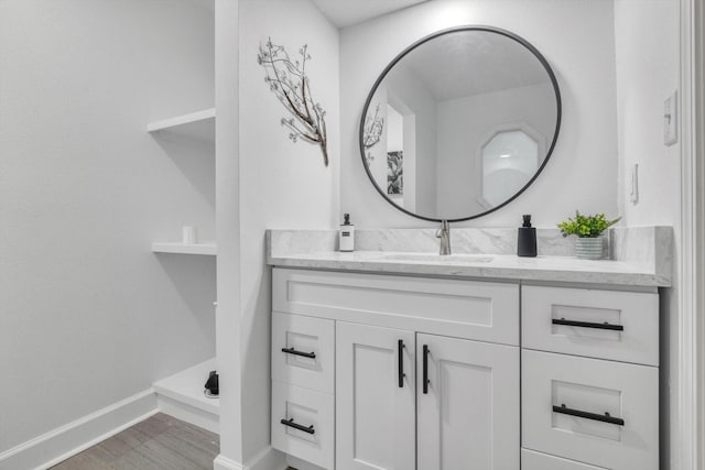 561 Brandon Rd, Conroe, TX 77302 - bathroom with baseboards, wood finished floors, and vanity