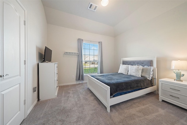 bedroom with baseboards, visible vents, lofted ceiling, and light colored carpet