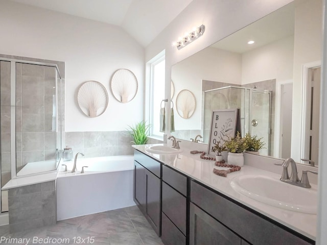 152 Bayou Bend Blvd, Angleton, TX 77515 - bathroom with vaulted ceiling, a stall shower, double vanity, and a bath