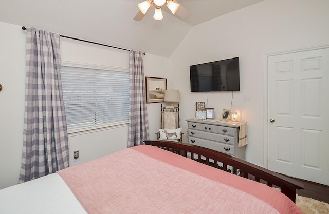bedroom featuring a ceiling fan and lofted ceiling