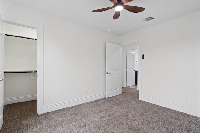12975 Corona Ct, Willis, TX 77318 - unfurnished bedroom featuring visible vents, carpet, a spacious closet, and a closet