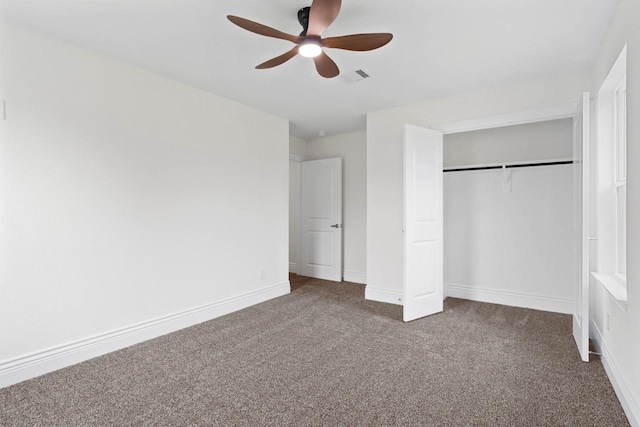 12975 Corona Ct, Willis, TX 77318 - unfurnished bedroom featuring carpet floors, visible vents, a closet, baseboards, and a ceiling fan