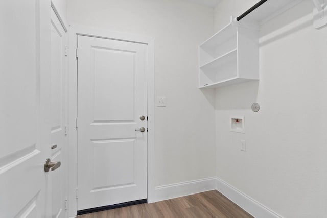 12975 Corona Ct, Willis, TX 77318 - laundry room with laundry area, hookup for a washing machine, baseboards, and dark wood-style flooring