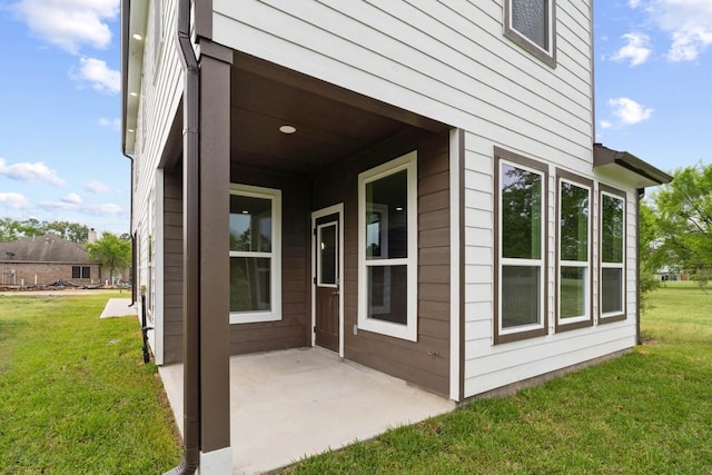 12975 Corona Ct, Willis, TX 77318 - entrance to property with a patio and a yard