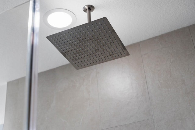 12975 Corona Ct, Willis, TX 77318 - room details featuring a tile shower