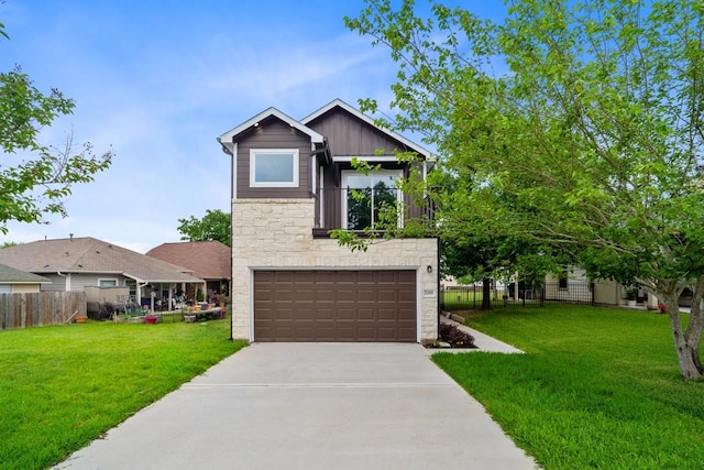 12975 Corona Ct, Willis, TX 77318 - view of front of home featuring fence, driveway, stone siding, and a garage