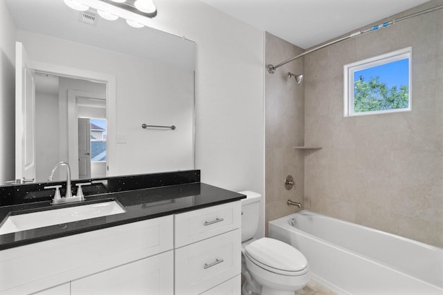 12975 Corona Ct, Willis, TX 77318 - full bathroom with vanity, shower / bathtub combination, toilet, and visible vents