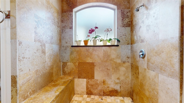 bathroom with a tile shower