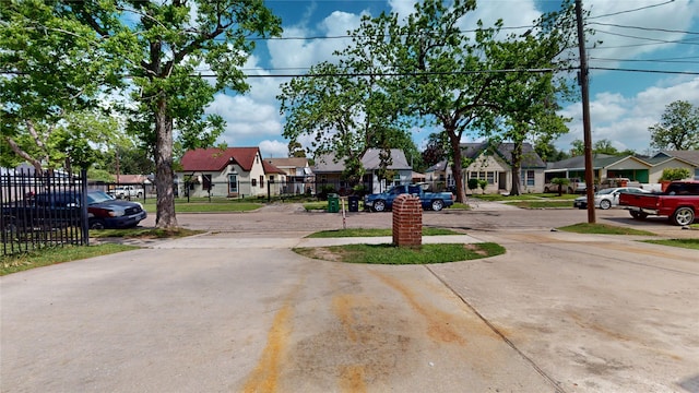 view of road with driveway and a residential view