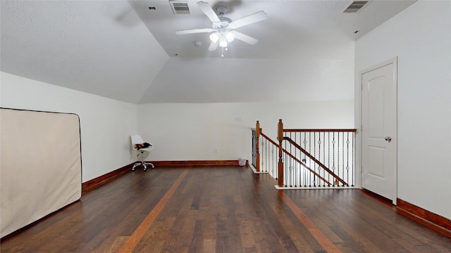 bonus room with lofted ceiling, visible vents, ceiling fan, baseboards, and wood finished floors