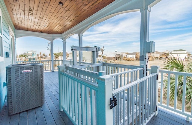 4110 Defender Ln, Galveston, TX 77554 - wooden terrace with central air condition unit