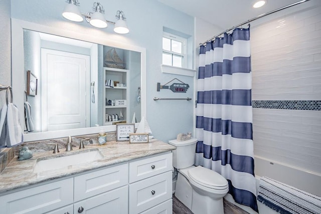 4110 Defender Ln, Galveston, TX 77554 - bathroom with radiator heating unit, vanity, toilet, and shower / bath combo