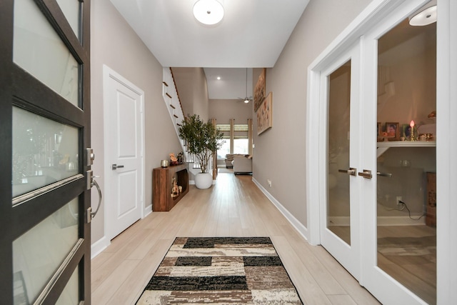 entrance foyer featuring a ceiling fan, french doors, baseboards, light wood-style floors, and recessed lighting