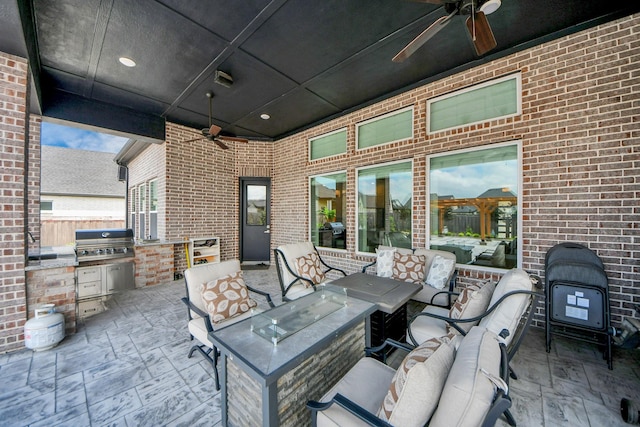 view of patio / terrace featuring an outdoor kitchen, ceiling fan, area for grilling, and outdoor lounge area