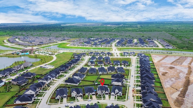 aerial view featuring a residential view and a water view