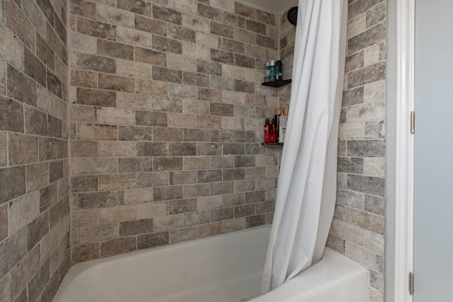full bathroom with shower / tub combo with curtain