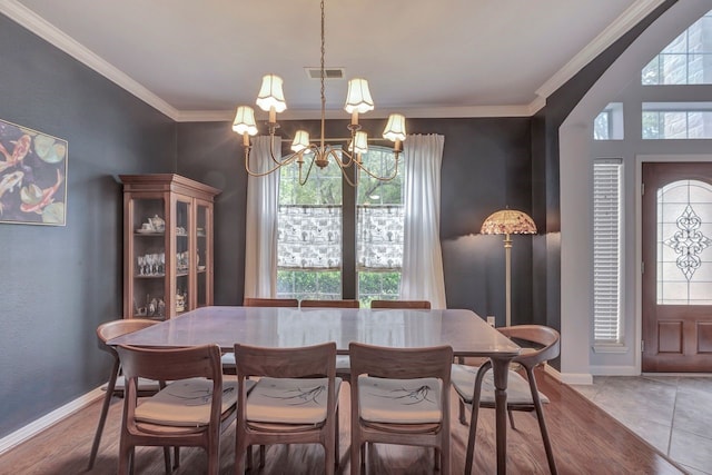 4526 Ambrosia Springs Ln, Katy, TX 77494 - dining room featuring a chandelier, healthy amount of natural light, ornamental molding, and baseboards